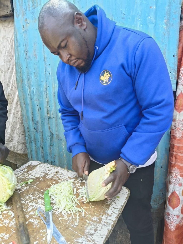 A Zoe Transforming Foundation team member preparing a meal